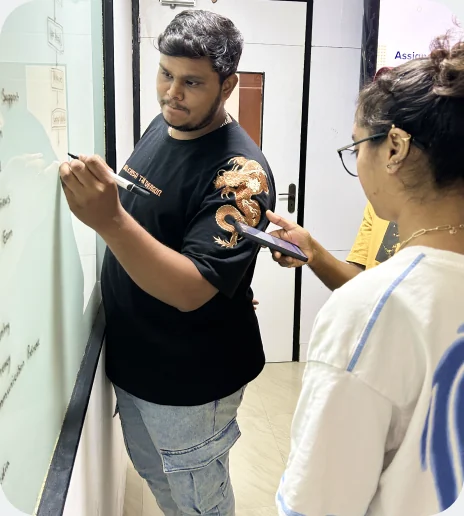 Students at Aspira's UI UX training in Chennai working together on a whiteboard
