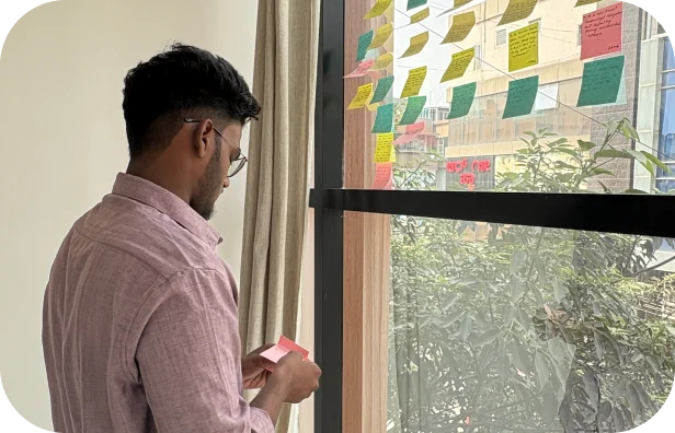 Student mapping user research on sticky notes during UI UX design classes in Chennai